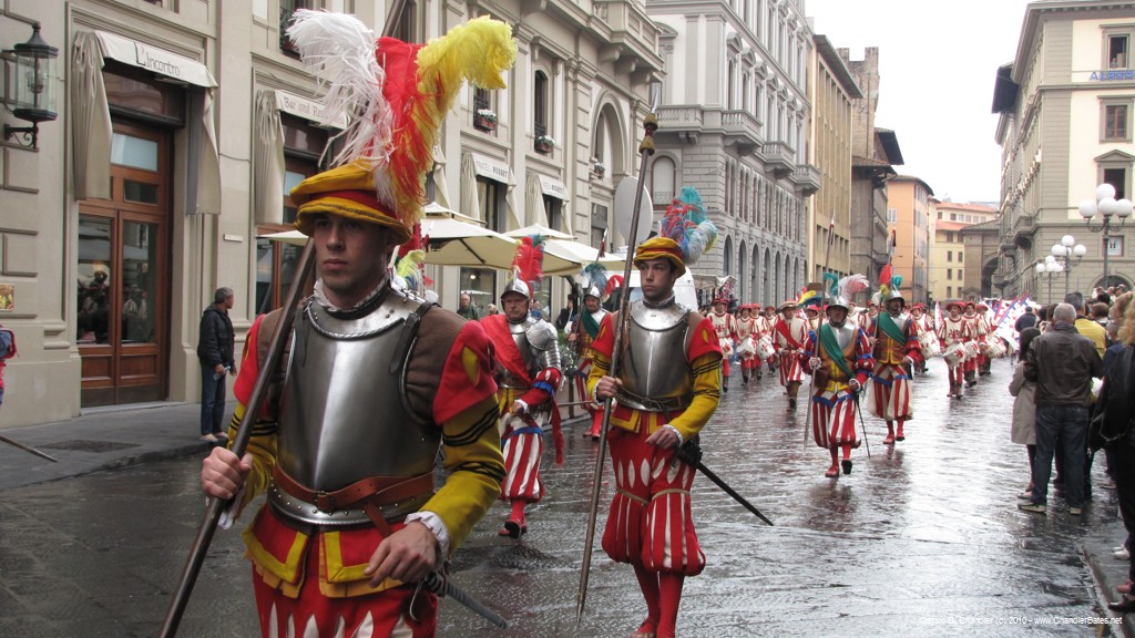 Men in 15th century costumes leading the cart to the cathedral