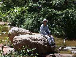 Jan on rock in stream, Oak Creek Canyon