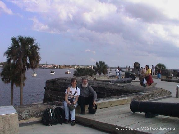 Jan and Gerry sitting outside Castillo de San Marcos admiring it.