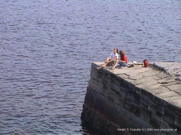 Women sunning on pier on Matanzas Bay